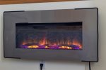 Electric fireplace adds to the feeling of warmth and elegance.
